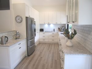Robinson Chapel Hill Shaker Style Kitchen in Resene Rice Cake with Caesarstone Alantic Salt Benchtops